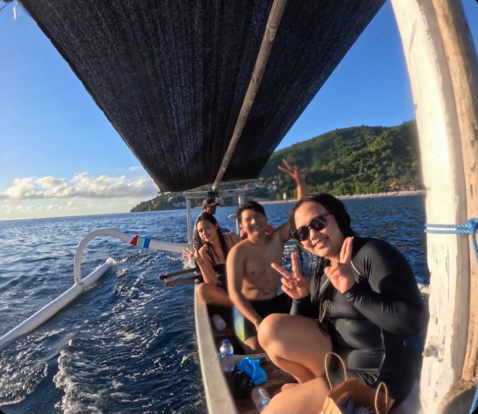Travelers enjoying a traditional Bali boat trip