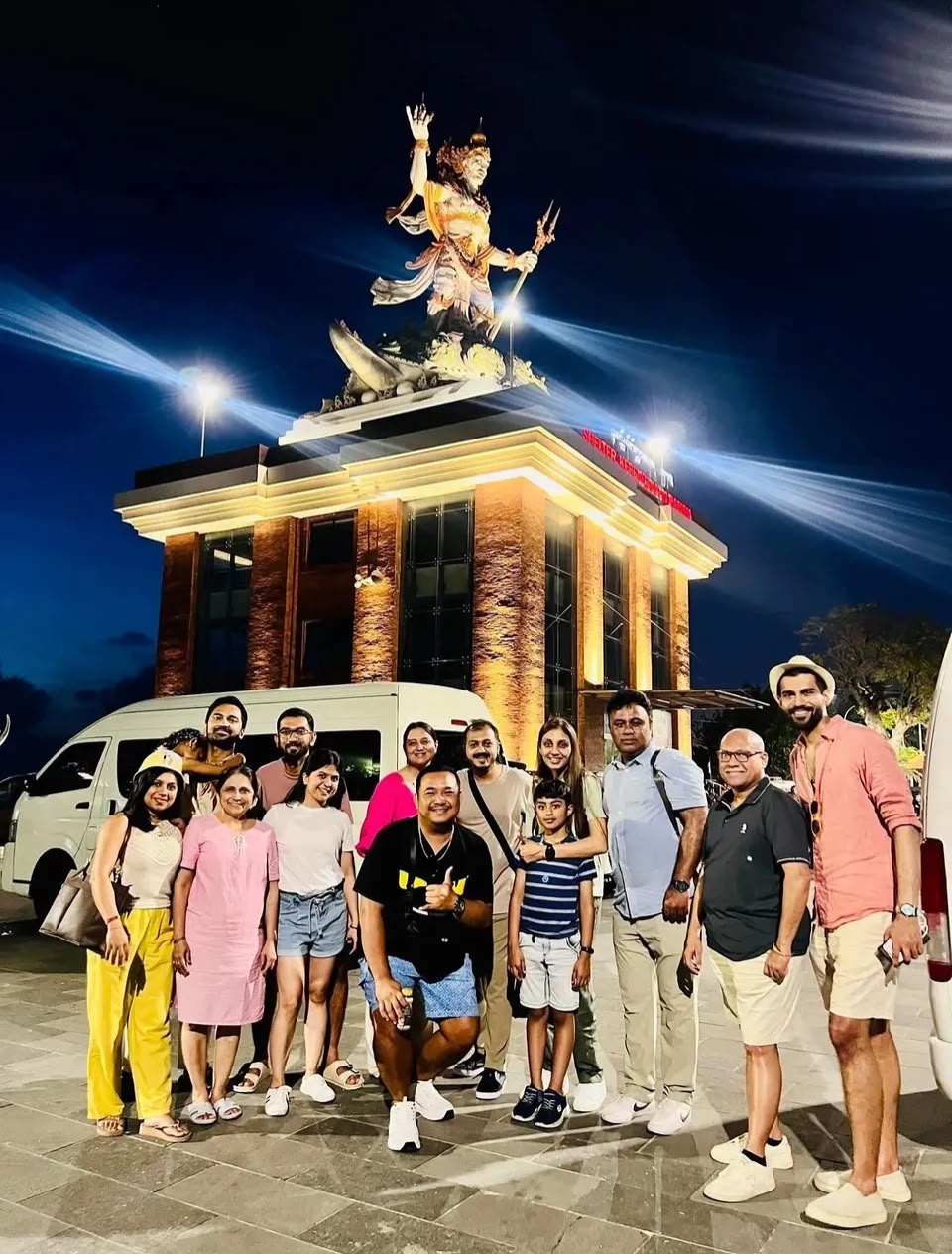Bali group arrival beneath a cultural landmark
