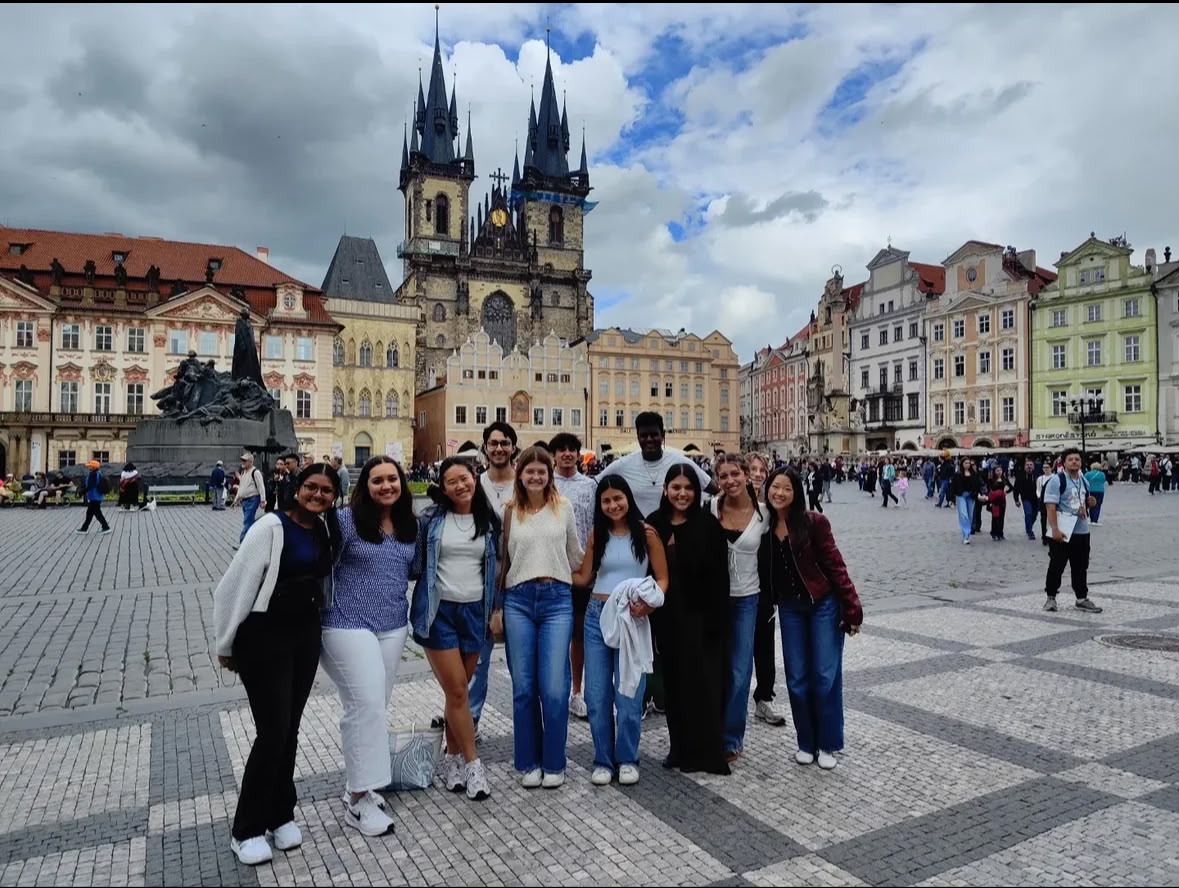 Group exploring a European heritage square